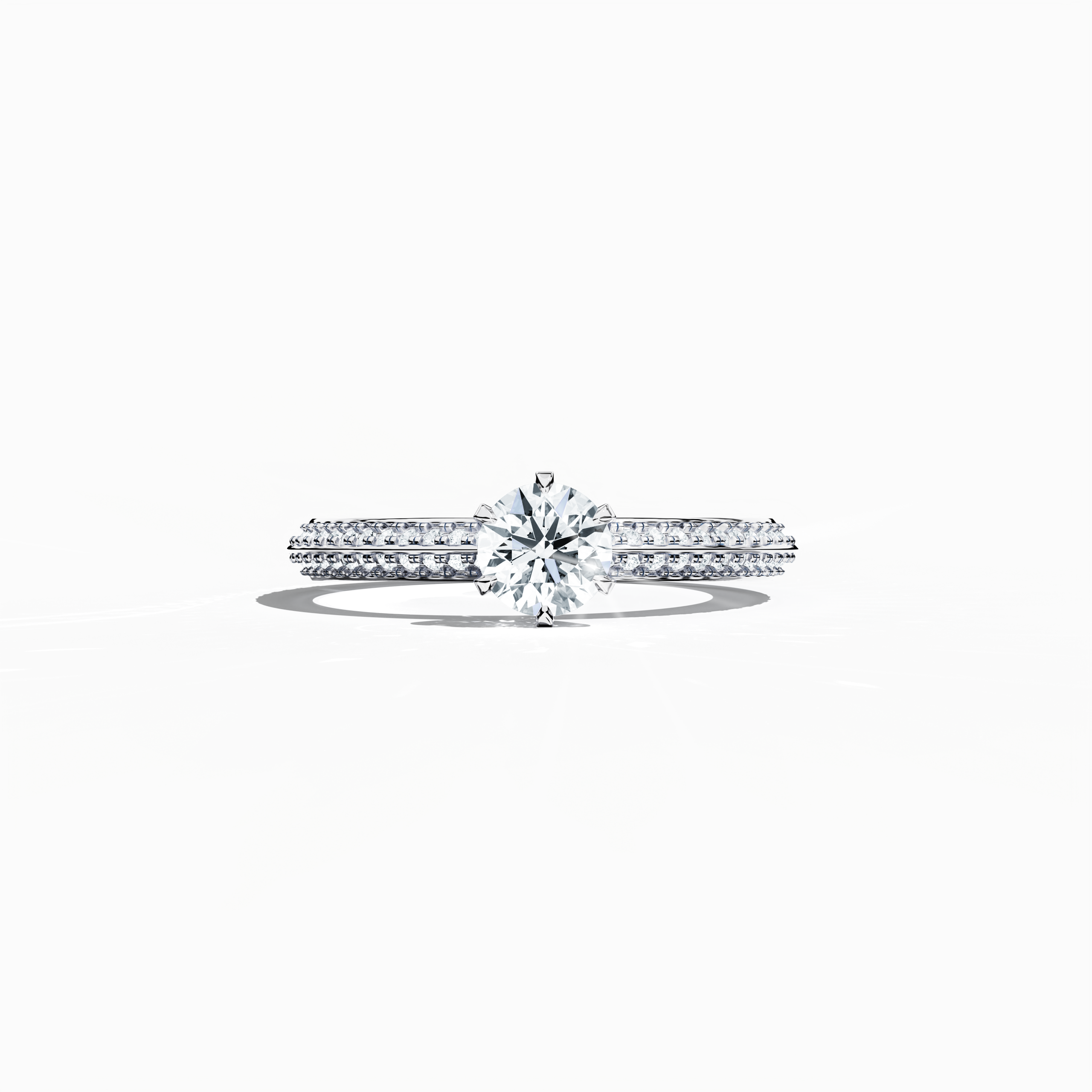 Solitaire paved ring with 0.90ct total diamonds – featuring a 0.50ct center diamond and 0.40ct pavé side stones – set in a bright white gold band with a modern two‑step band design and a sharp central line. Shown in a sleeping front view on a flat surface, this fine jewelry/fine jewellery piece radiates sleek elegance and luminous sophistication.