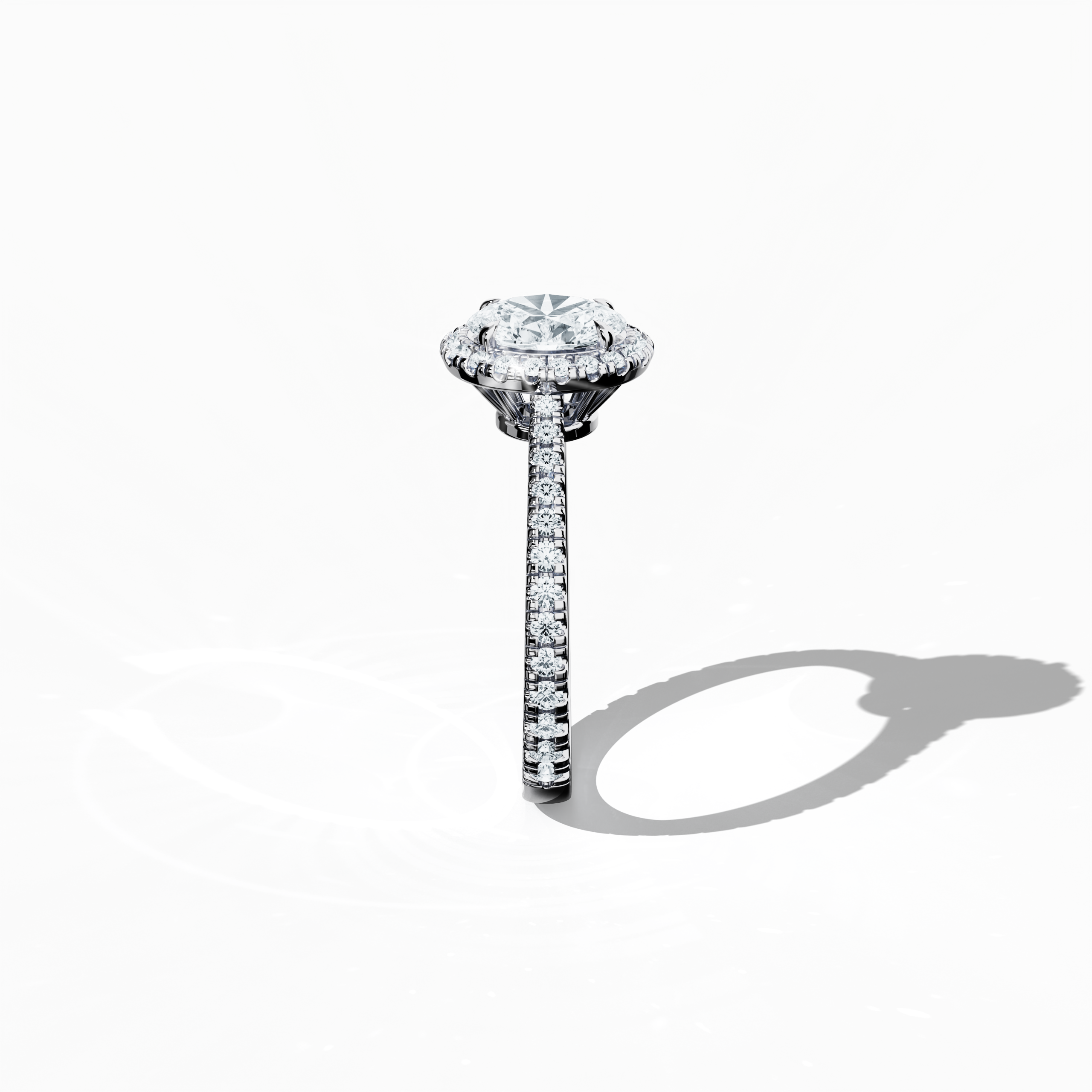 Detailed standing side view of a white gold halo paved ring, accentuating its elegant profile and gracefully curved band adorned with a 1ct oval-cut central diamond and a 0.60ct side diamond halo. This lateral angle reveals intricate pavé detailing in white, silver, and pale gold that merges classic halo, vintage halo, modern halo, and bridal halo aesthetics. Keywords: luxury, refined design, oval brilliance, artistic detailing, modern elegance.