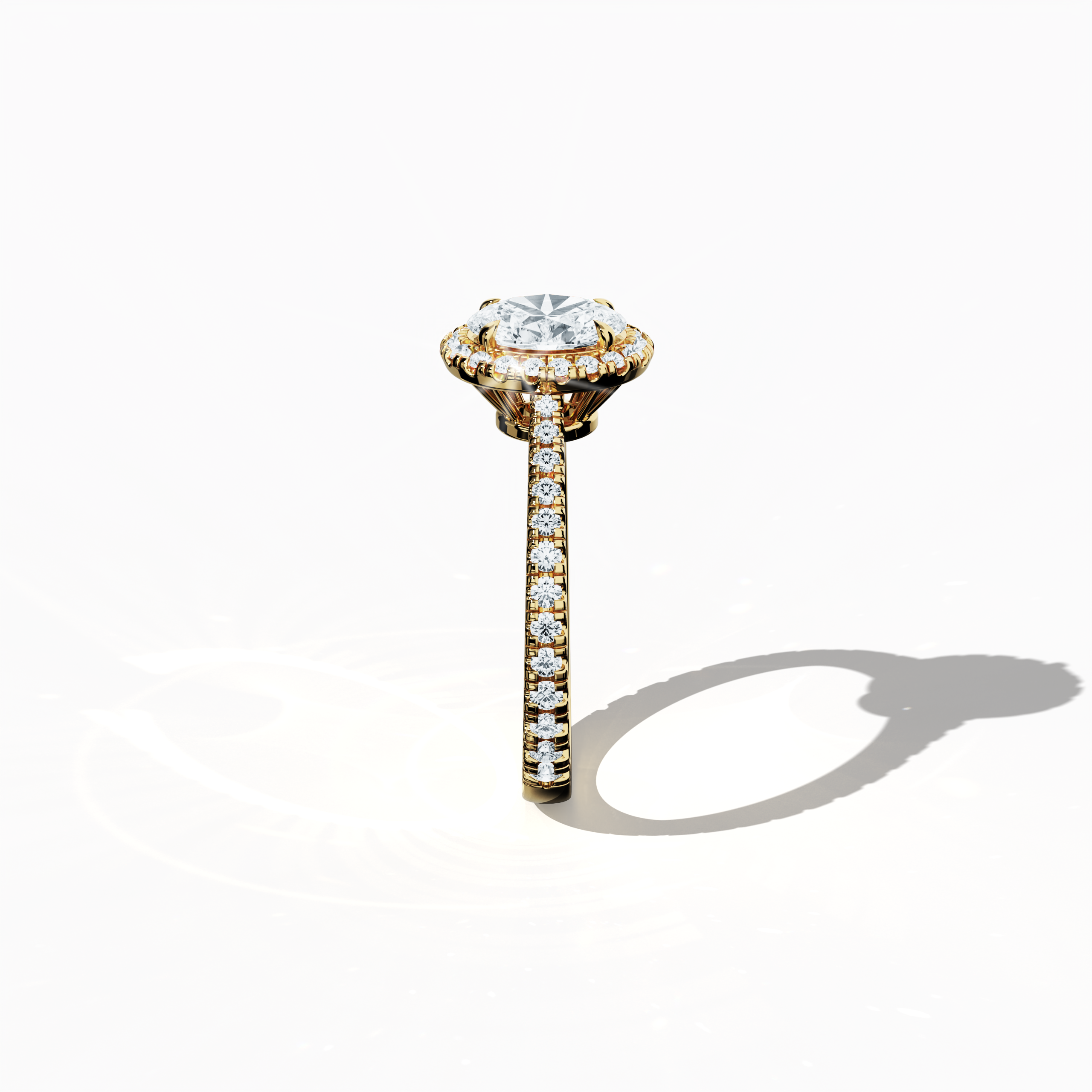 Detailed standing side view of a yellow gold halo paved ring, accentuating its elegant silhouette and curved band adorned with a 1ct oval-cut central diamond and a 0.60ct side diamond halo. The lateral perspective reveals intricate pavé settings in rich yellow, sun, and traditional gold tones, blending classic halo, vintage halo, modern halo, and bridal halo design aesthetics. Keywords: refined design, luxury, oval brilliance, contemporary style, artistic detail.