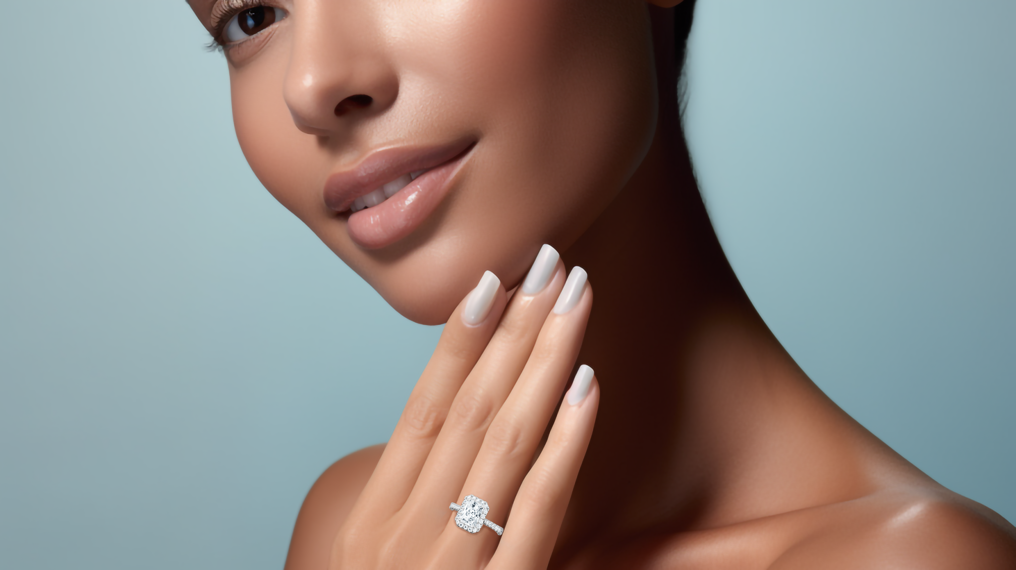 Stunning image of a white gold halo paved ring elegantly worn on her finger, featuring a sparkling 1 carat radiant-cut center diamond with a surrounding 0.60ct side diamond halo. The finely pavé-set band in white, silver, and pale gold exudes refined luxury and artisanal excellence. Incorporating classic halo, vintage halo, modern halo, and bridal halo motifs, the ring radiates radiant brilliance, timeless charm, and sophisticated elegance. Keywords: chic, graceful, luxury jewelry.

