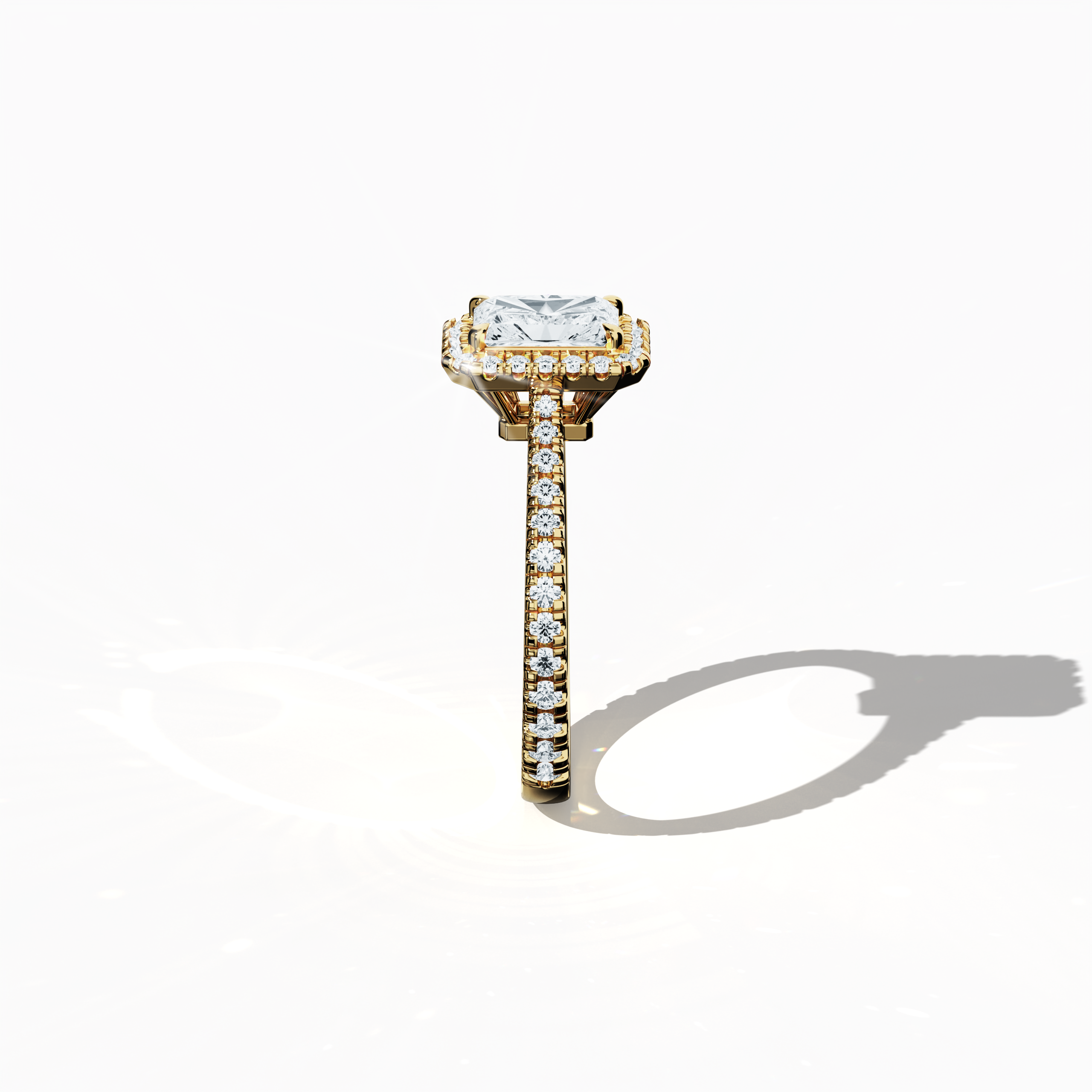 Detailed standing side view of a yellow gold halo paved ring, accentuating its elegant silhouette and curved band adorned with a 1 carat radiant-cut center diamond and a complementary 0.60ct side diamond halo. The lateral view reveals intricate pavé settings in rich yellow, sun, and traditional gold tones, fusing classic halo, vintage halo, modern halo, and bridal halo aesthetics. Keywords: refined design, luxury, radiant brilliance, contemporary style, artistic detail.