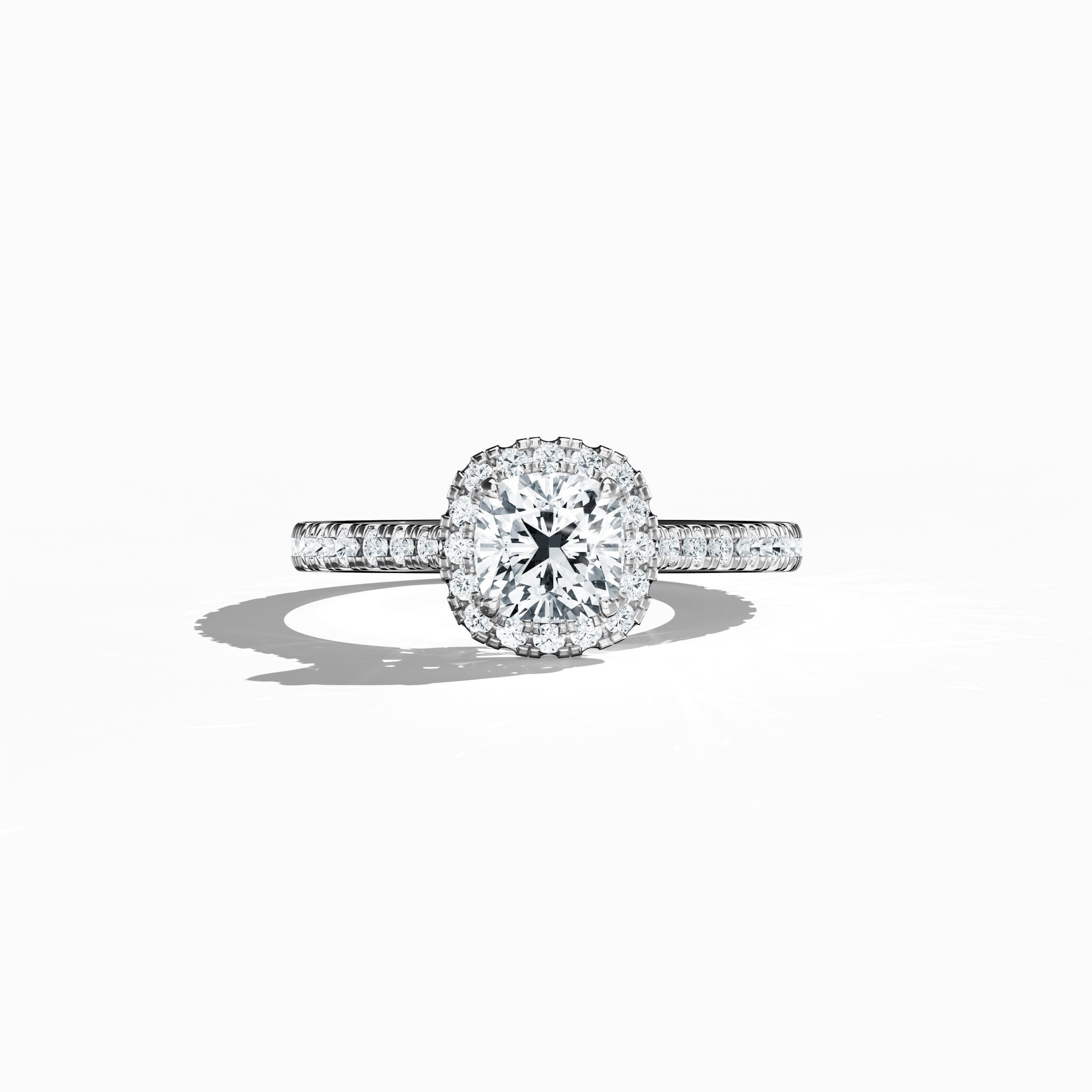 Displayed in a soft sleeping front view, this halo paved diamond ring in exquisite white gold radiates refined brilliance. With a total weight of 1.60 carats, its 1 ct cushion cut centerpiece is encircled by a 0.60 ct halo of glistening side stones. The design fuses Classic Halo, Modern Halo, and Vintage Halo aesthetics with cushion and radiant influences, highlighted by a frosted, silver-toned finish. Keywords: luxury, handcrafted, sparkle, elegant, diamond.

