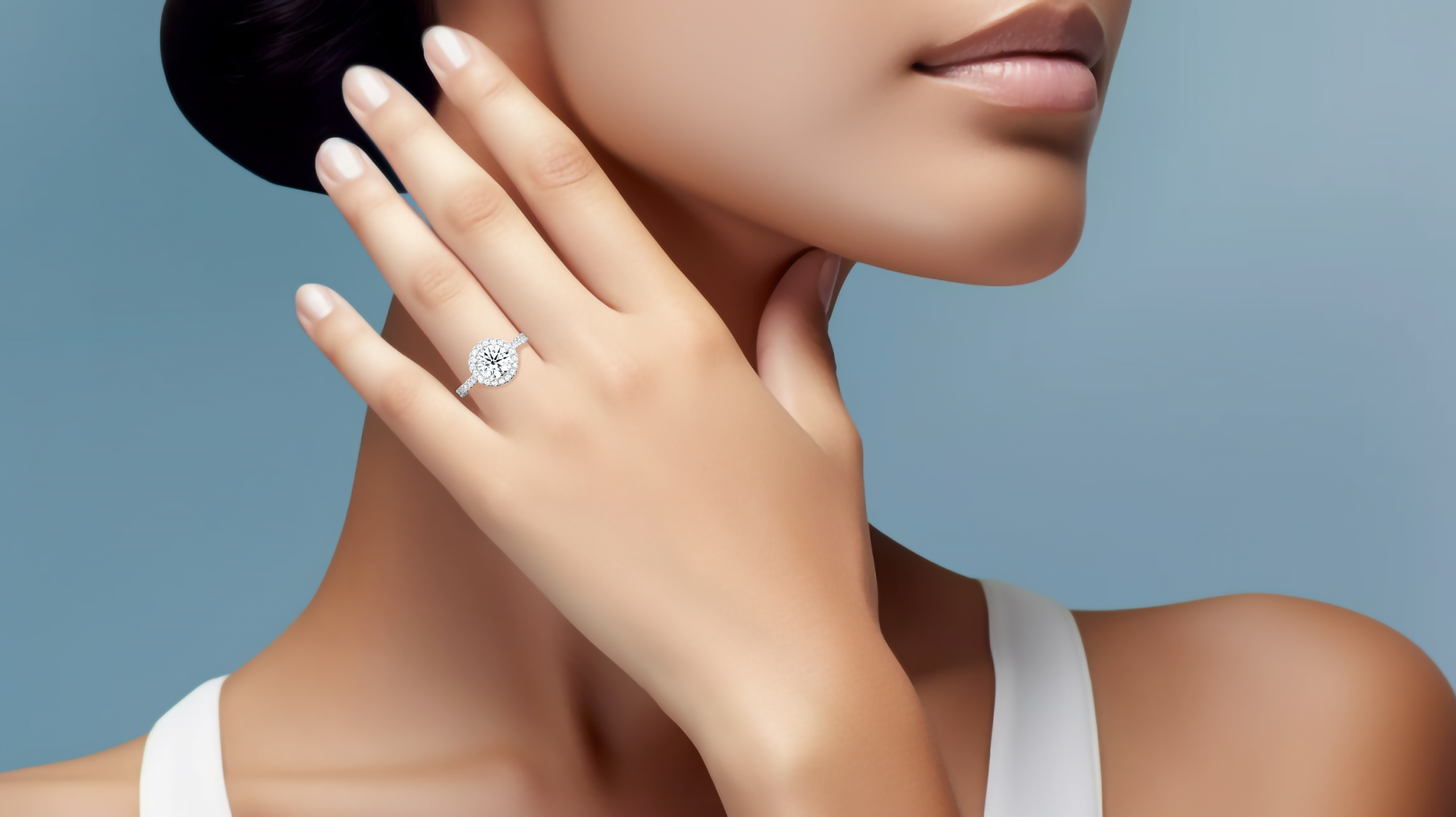 Stunning image of a white gold halo paved ring elegantly worn on her finger, featuring a sparkling 1ct round‐cut center diamond and a surrounding 0.60ct side diamond halo. The exquisite pavé-set band in shades of white, silver, and pale gold exudes refined luxury and sophisticated craftsmanship. Incorporating classic halo, vintage halo, modern halo, and bridal halo design motifs, it radiates round brilliance, timeless style, and international elegance. Keywords: chic, graceful, statement jewelry.

