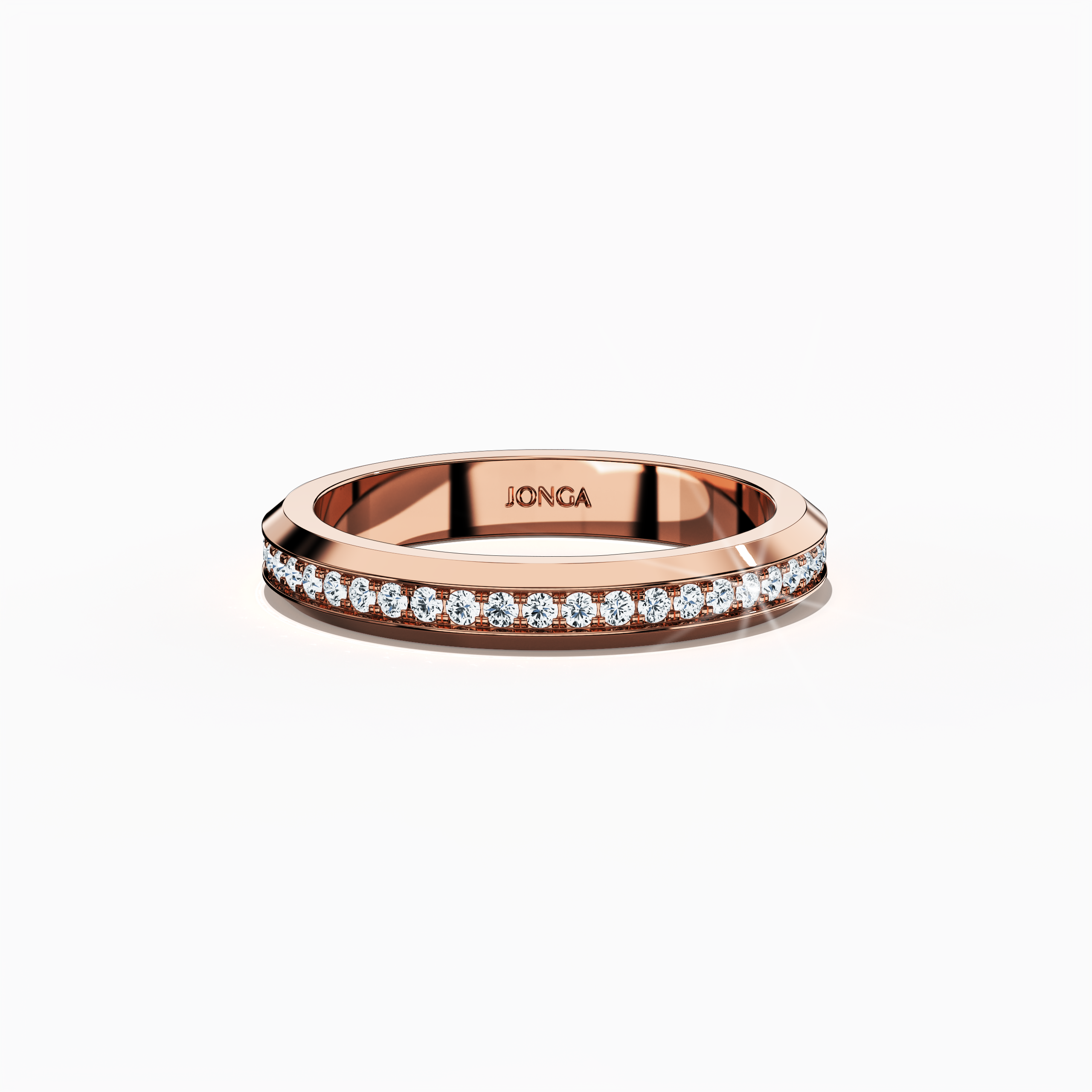 Detailed view of a rose gold paved band photographed from a sleeping front top angle, accentuating its central pavé motif rendered in full pave, scattered pave, and cluster pave styles. The band’s radiant rose gold center—known in refined design as “rosé gold” or “blush gold”—contrasts with its smooth glossy perimeter, showcasing modern elegance and impeccable artisanal skill. Keywords: elegant, luxurious, refined, intricate, contemporary design.