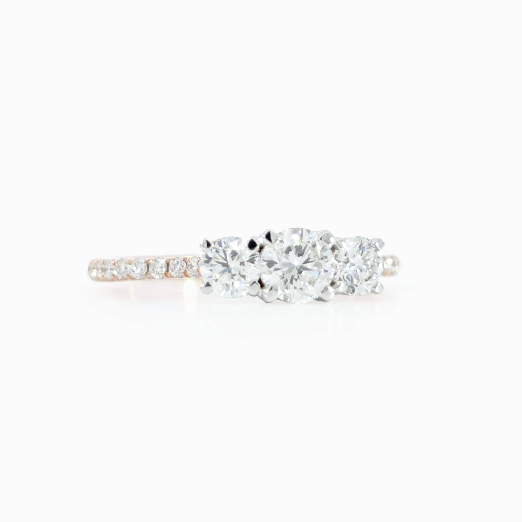 Round Trio Pave Ring side view showing 0.81 carat D-F color VVS-VS clarity diamonds in polished 18K rose gold
