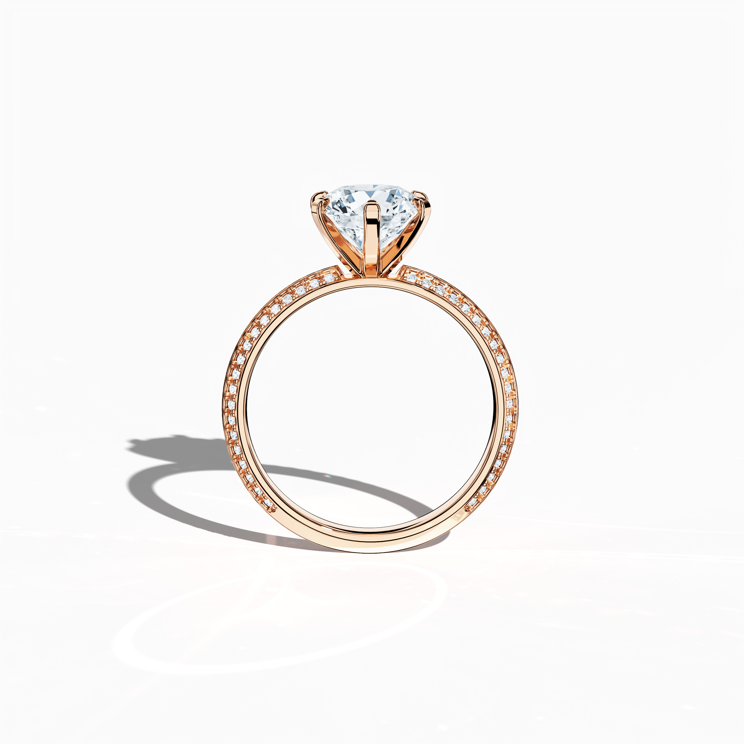Classic solitaire diamond ring with 2.40 ct total carats—2 ct center diamond and 0.40 ct pavé side stones—set in soft rose gold (blush/pink gold) with a distinctive two‑step band featuring a crisp central line. Displayed in a front view, this fine jewelry/fine jewellery ring offers a perfect blend of brilliant sparkle and contemporary romance.