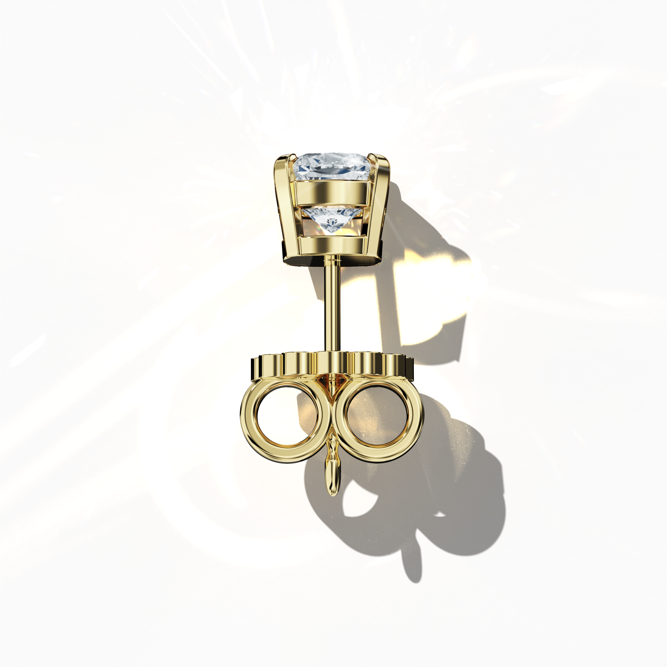 Top view of 1-carat natural diamond earring in 18k yellow gold with nail prong setting; features a cushion cut diamond (also known as cushion brilliant or pillow cut diamond in various regions) – luxury fine jewelry/fine jewellery ear accessory.