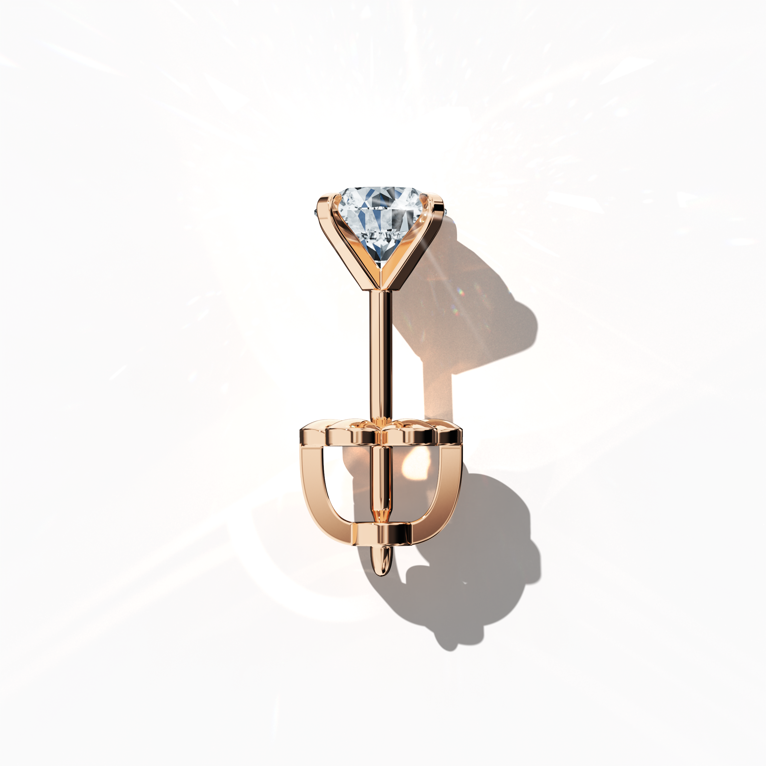 Top view of 2 carat natural diamond earring in 18k rose gold with nail prong setting; diamond stud, 2ct solitaire diamond, luxury fine jewelry/fine jewellery ear accessory.