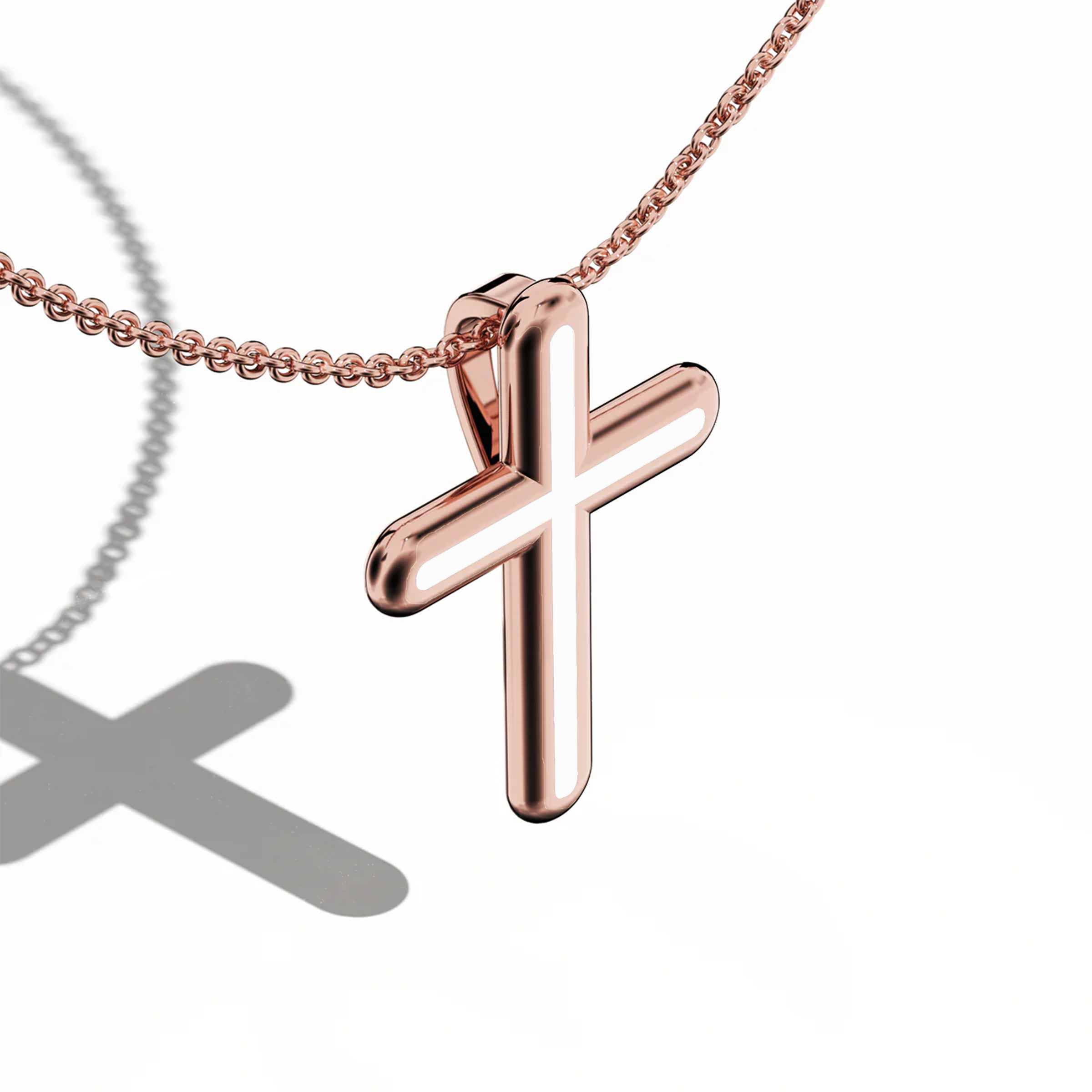 Front top side view of a center enamel cross pendant in radiant rose gold, occasionally called pink or blush gold. The bright white enamel (sometimes labeled pearl or ivory) outlines the multi-step or tri-tier cross shape from this angled perspective. Polished edges highlight a refined blend of warm metal and fresh enamel, marrying tradition with contemporary charm. Keywords: enamel cross, rose gold, white enamel, tri-tier design.