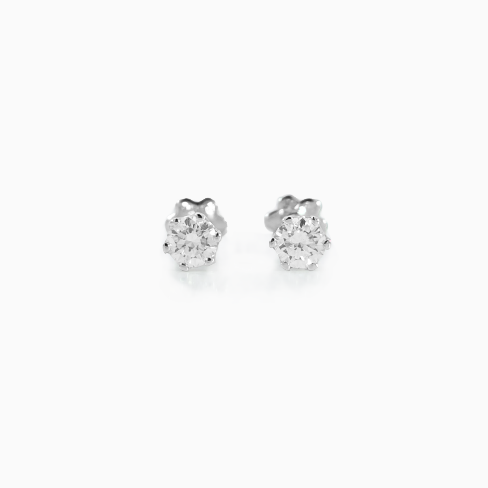 Classic Studs small Size 0.12 carat total diamond D-F color VS clarity 18K white gold handcrafted in Dubai
