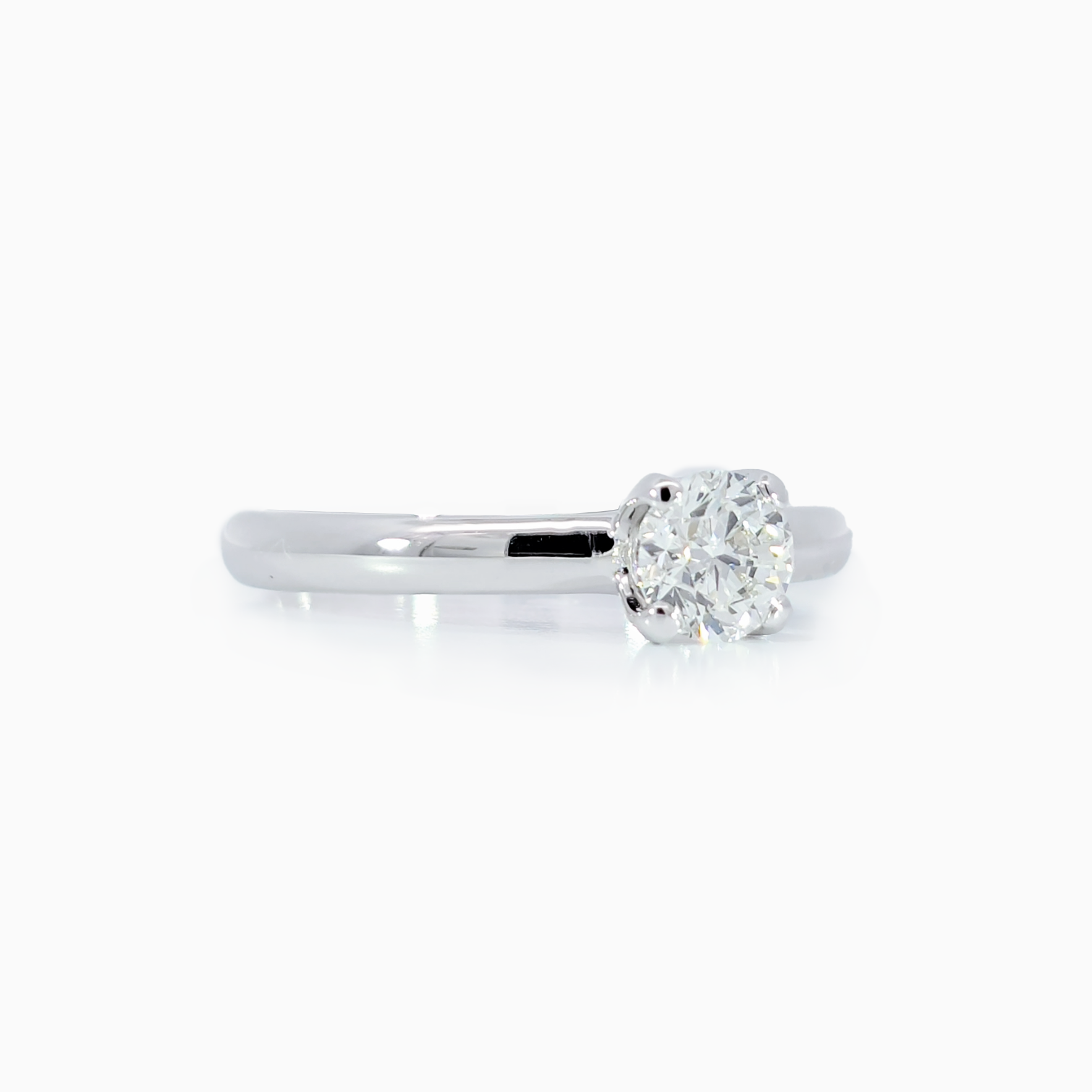 Classic Solitaire Ring side view showing 18K white gold band and 0.50 carat diamond setting by Jonga
