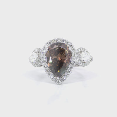 Brown diamond pear trio halo ring detailed video displaying trio halo setting and VVS-VS clarity side diamonds
