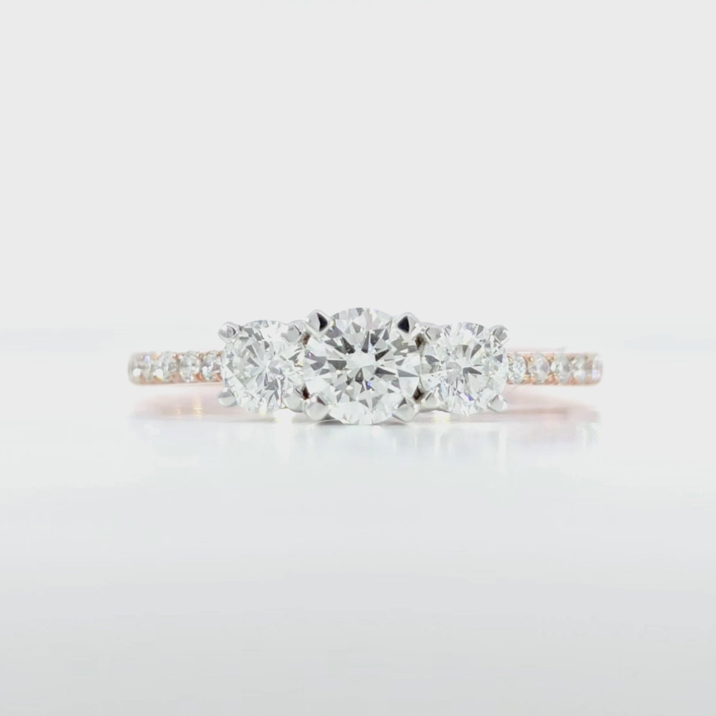 Round Trio Pave Ring video displaying 0.81 carat total D-F color VVS-VS clarity diamonds and rose gold craftsmanship
