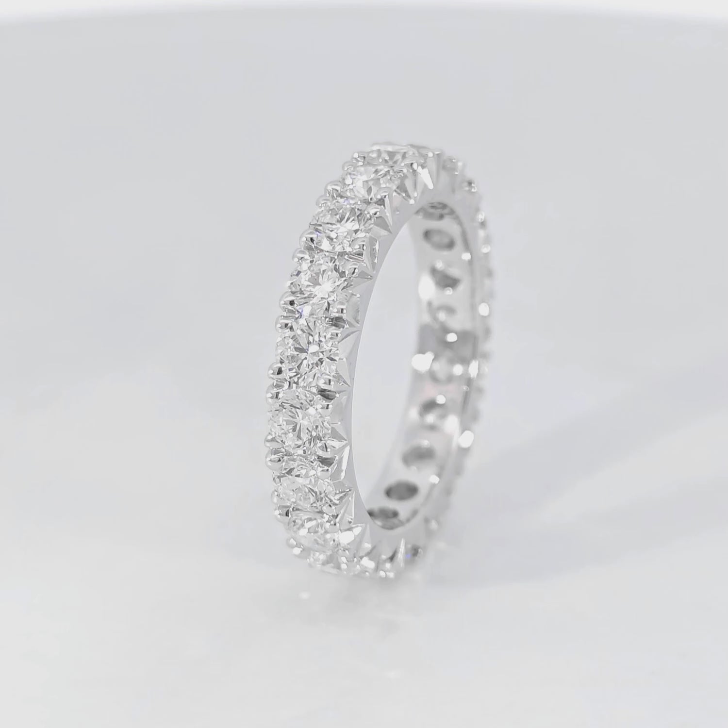 Round Eternity Band Fishtail Setting video displaying 2.58 carat total D-F color VVS-VS clarity diamonds white gold craftsmanship
