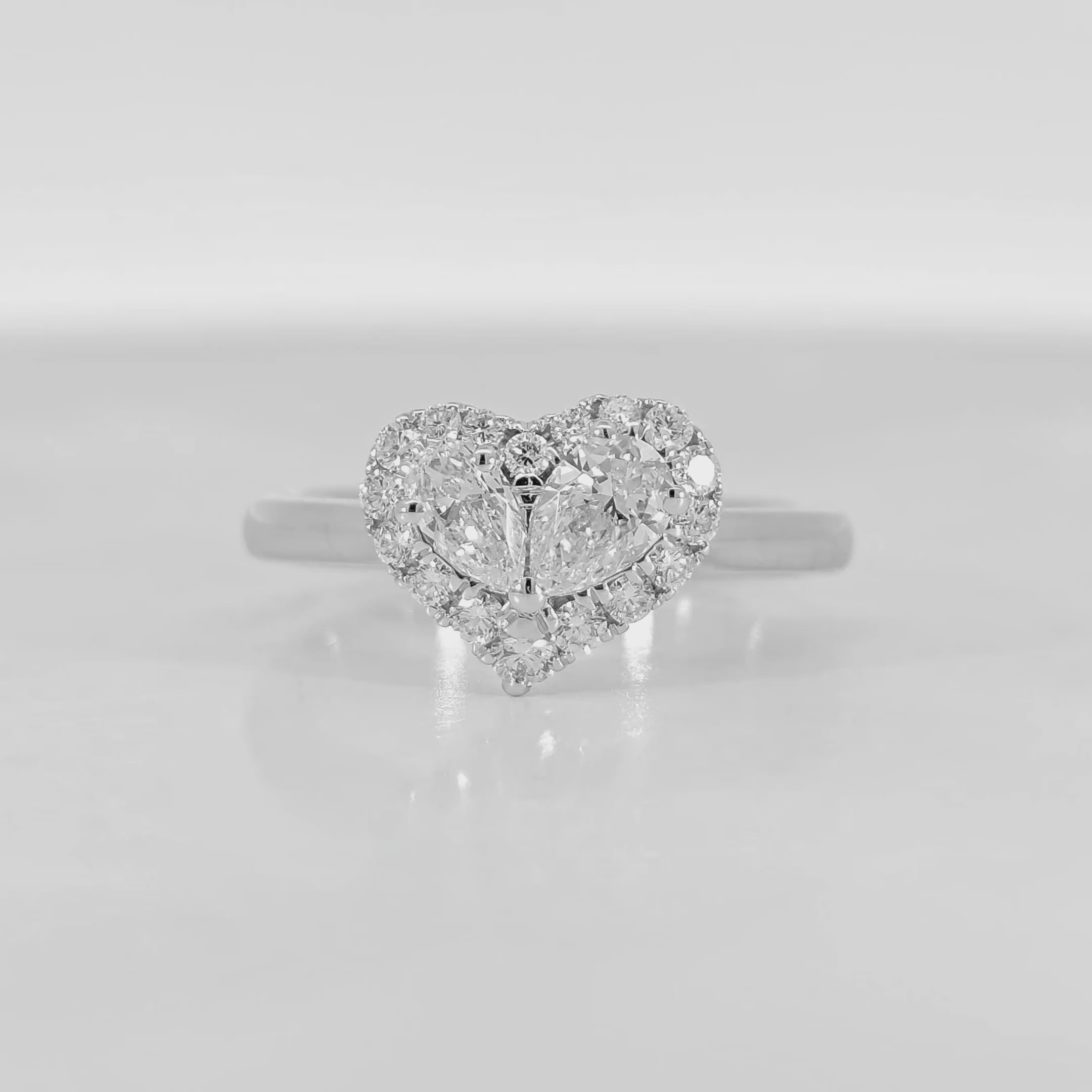 Heart shaped pear diamond halo ring video 0.70 carat total GIA certified F color VS clarity pear diamond white gold craftsmanship
