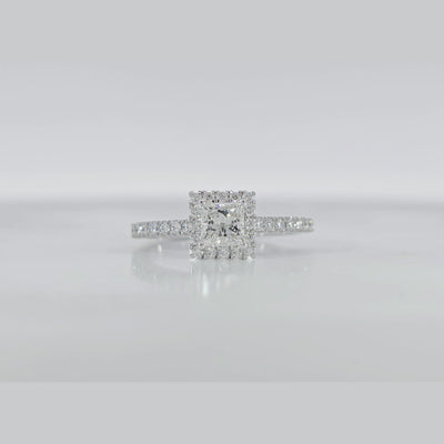 Halo Princess Ring video displaying GIA certified VVS clarity princess cut diamond and luxury white gold finish
